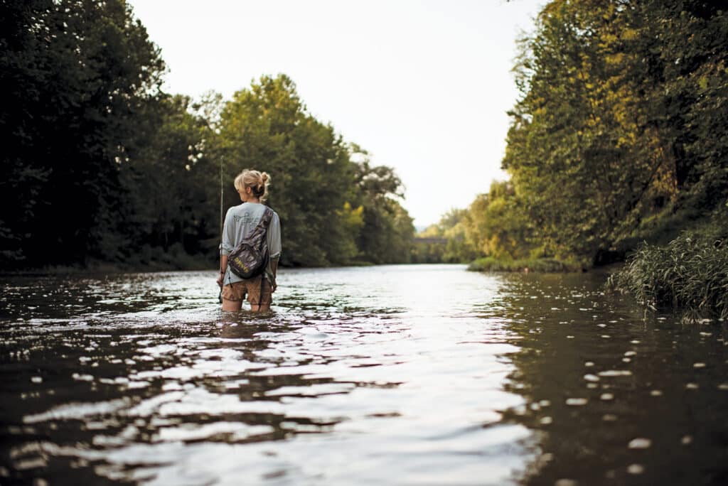 Women standing in a creek