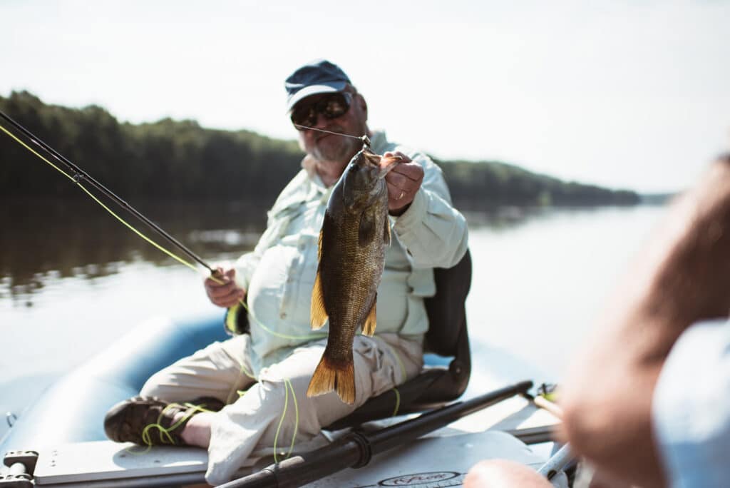 Man holding out fish