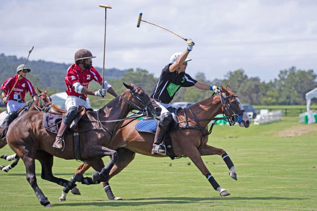 Nacho Figueras racing across the polo field in active Virginia polo match at Great Meadow.