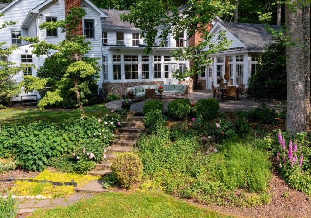 Exterior shot of the Holly Hollow's backyard patio and garden