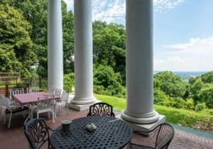 Exterior shot of the back patio with large pillars