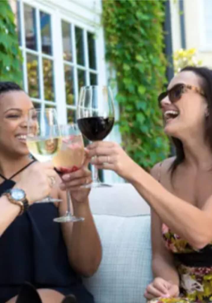 Women enjoying wine at Salamander Middleburg in Virginia's hunt country.