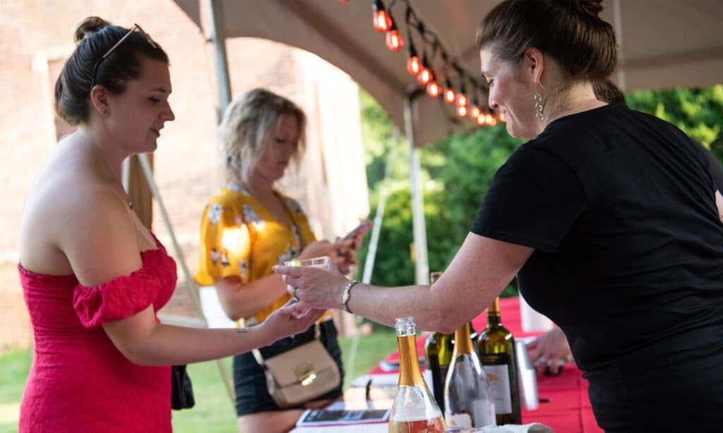 Guests enjoying wine before Shakespeare at the Ruins theatre performed outdoors in Virginia Wine Country.