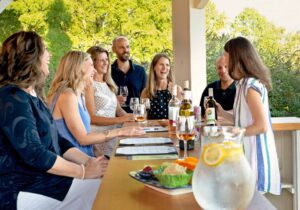 Photo of a gathering enjoying wine at Cana Vineyards