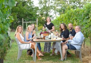 Photo of a gathering among the vineyards at Cana Vineyards