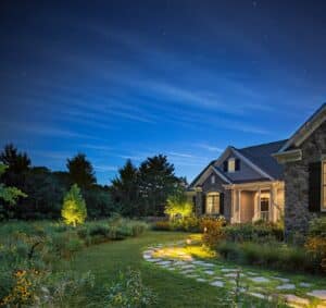 Partial exterior shot of a house at dusk. Jennifer Horn Landscape Architecture