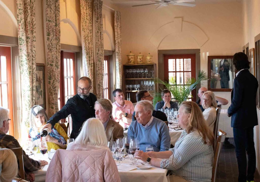 Sommelier Alessandro Medici of Palladio restaurant and Barboursville Vineyards pouring wine for guests.