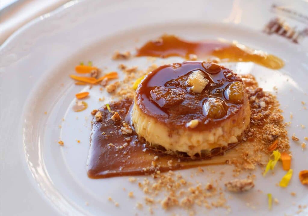 Close up of dessert with edible flowers at Tuscan Feast, a collaboration with Italy's Castello di Albola and Barboursville Vineyards.