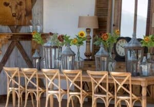 Exterior shot of a long table with chairs outside of the Creme de la Creme shop