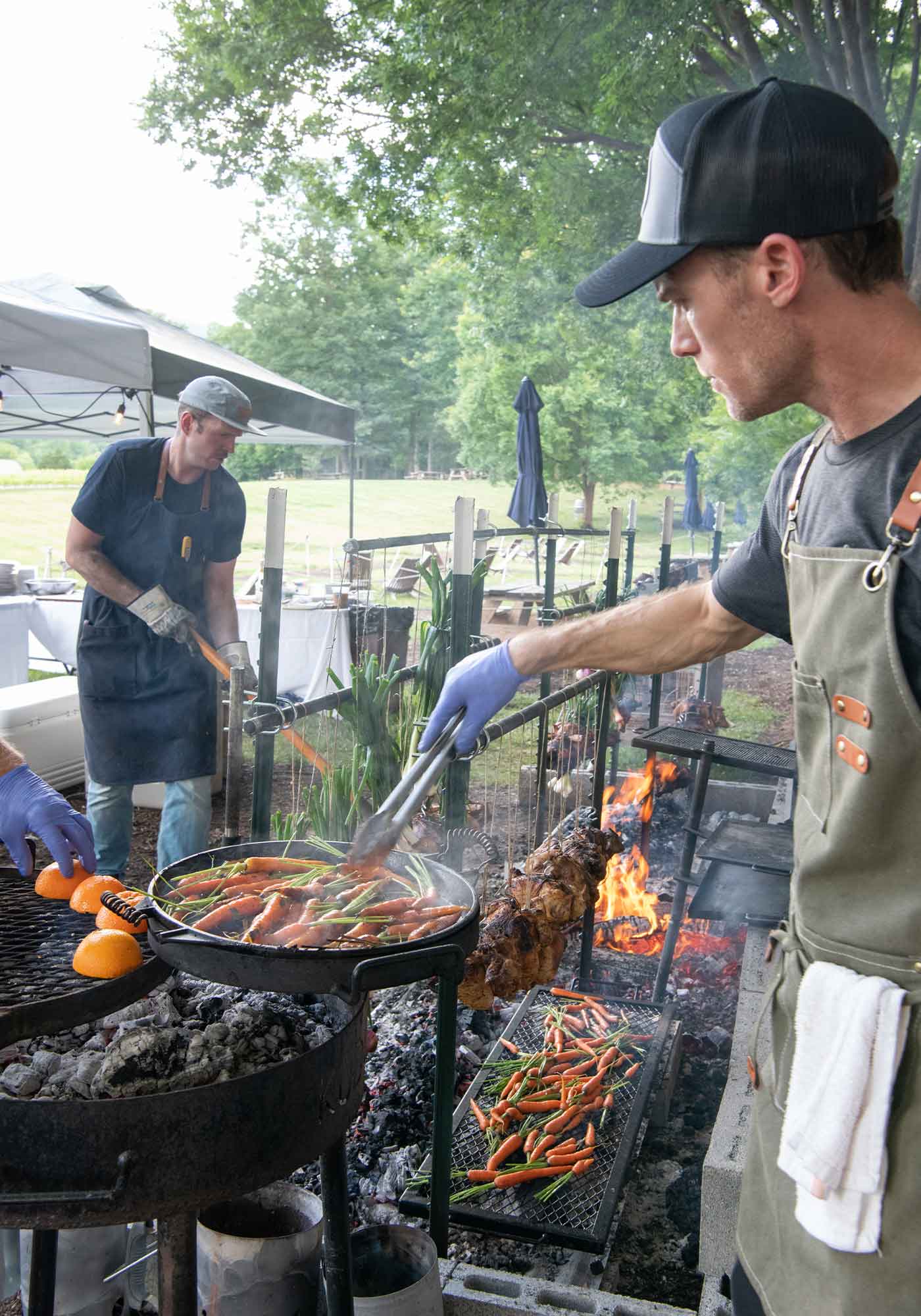 Veritas Dinner Supper Series featuring BLOOM Restaurant & Wine Bar of Roanoke VA, Winery dinner prepared over an open pit by chef/owner Nat Sloan. Veritas Winery in Nelson.