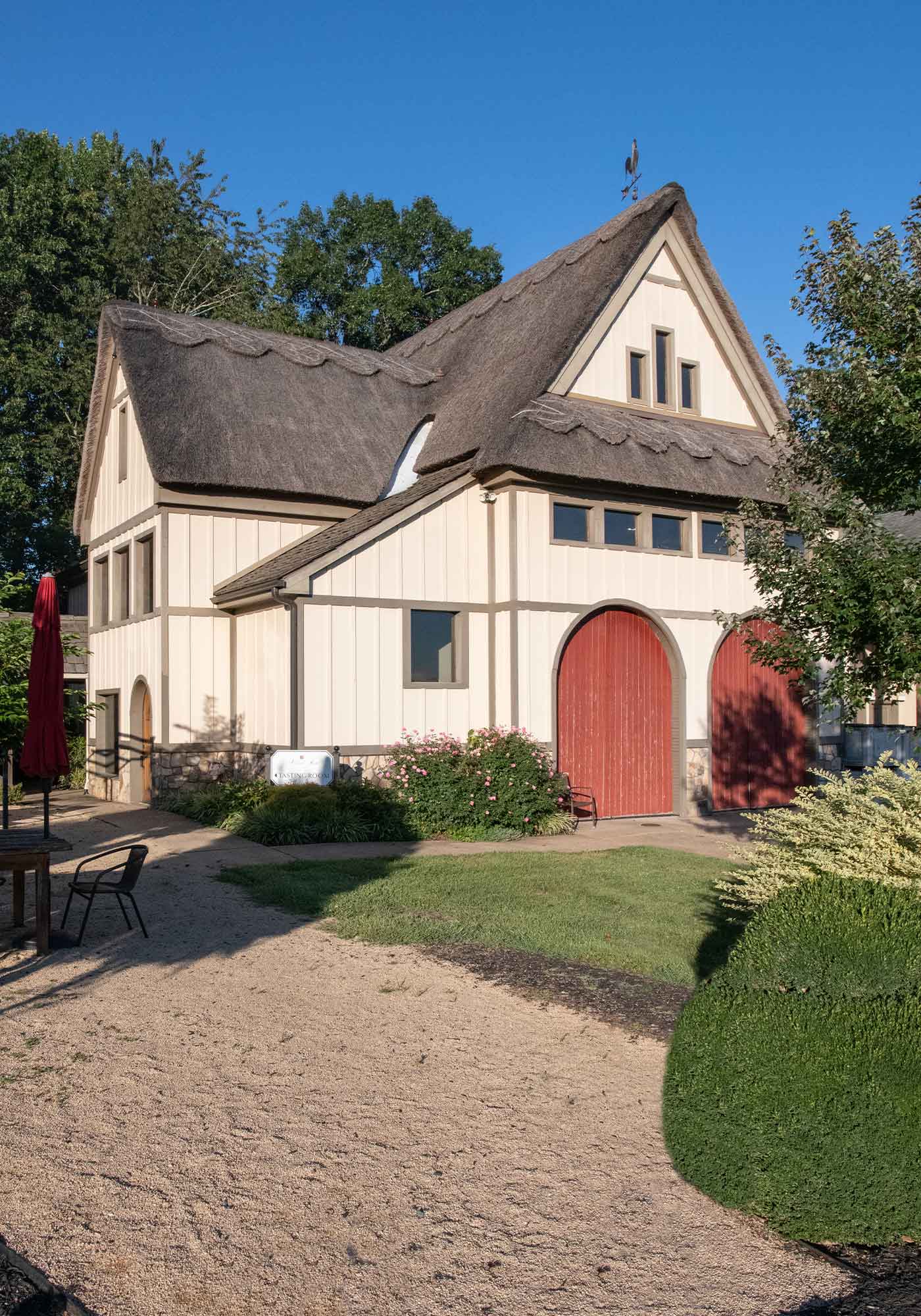 Thatched roof tasting Room at Michael Shaps Winery Charlottesville Virginia. french winemakers in virginia and virginia wine in france