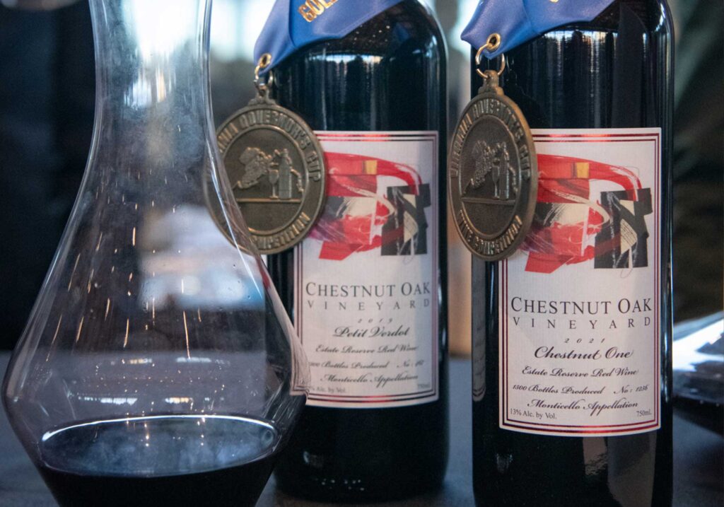 Photo of Chestnut Oak Vineyard wines displaying gold ribbons at 2024 Governor's Cup Gala in Richmond's Main Street Station.