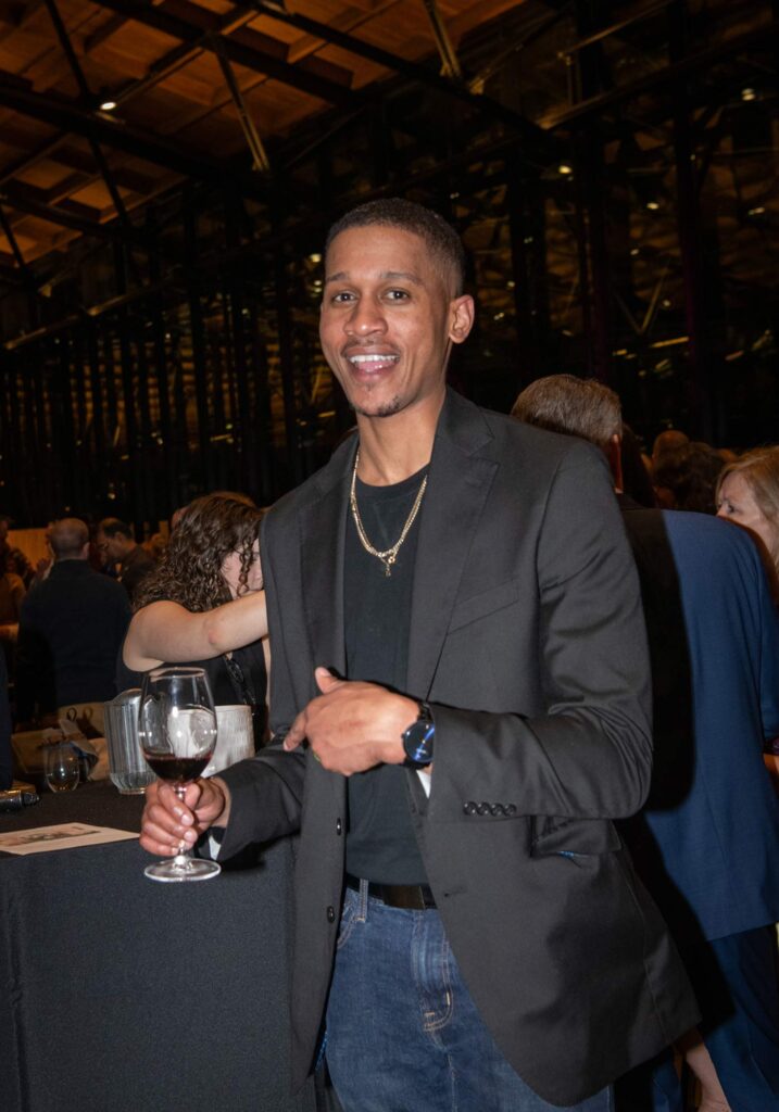 Photo of Lance Lemon tasting the best of Virginia wines at 2024 Governor's Cup Gala.