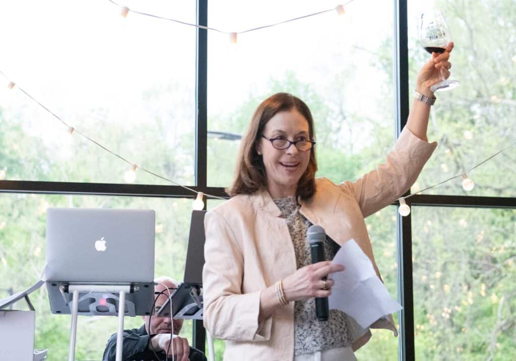 Mollie Hardie, co-owner of Keswick Hall Resort, gives toast to gold medal wines at 2024 Monticello Wine Cup gala at Charlottesville venue, The Wool Factory.